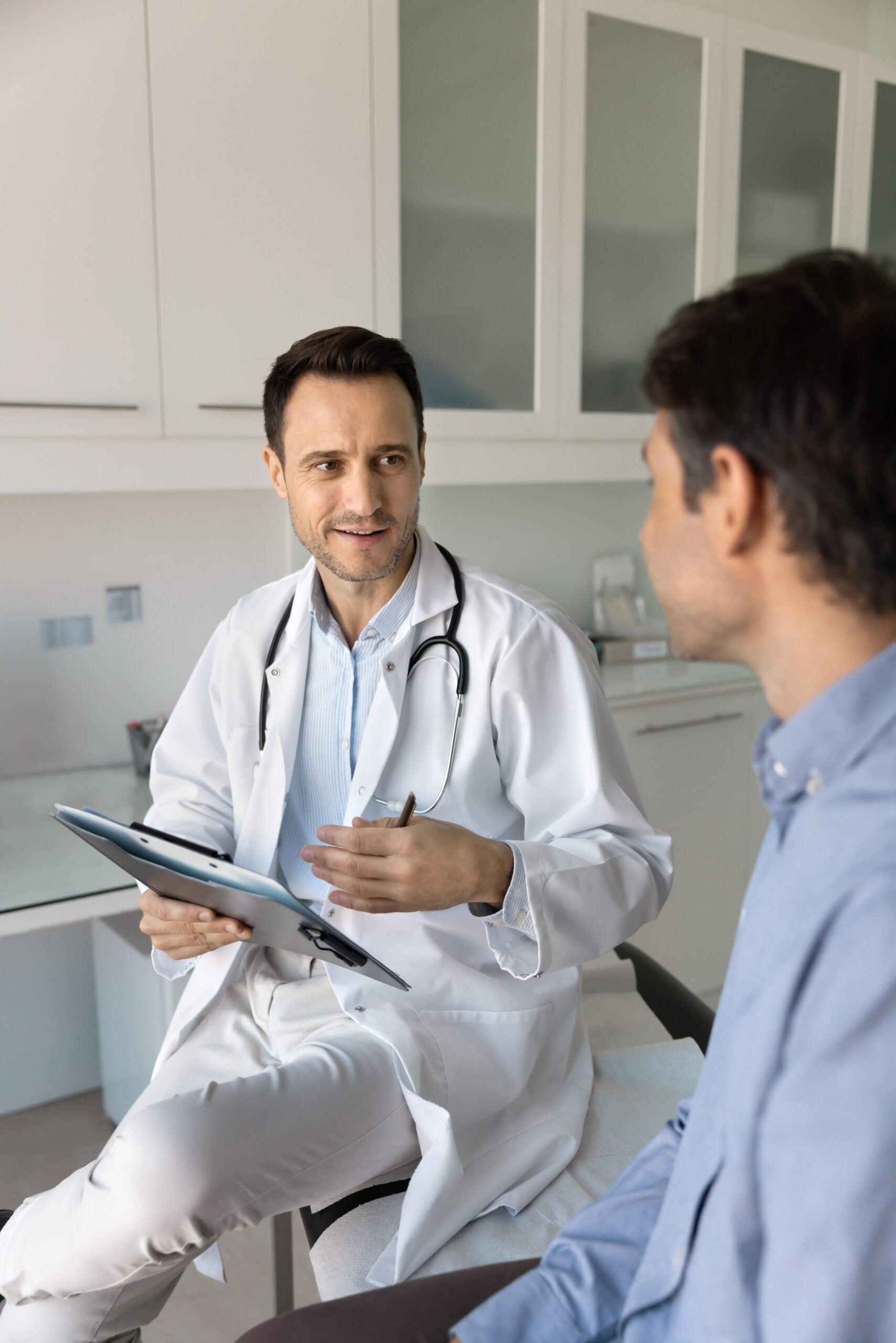 Male doctor talking to patient