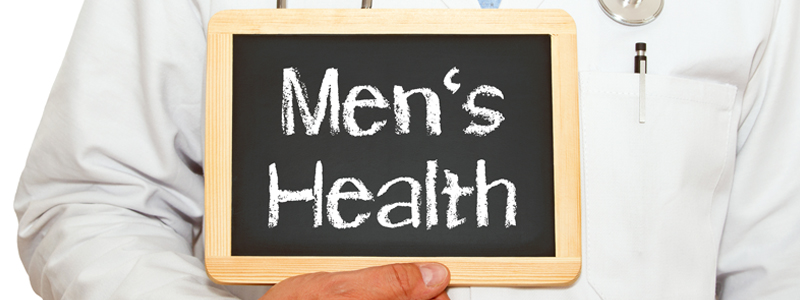 Doctor holding sign that says Men's Health