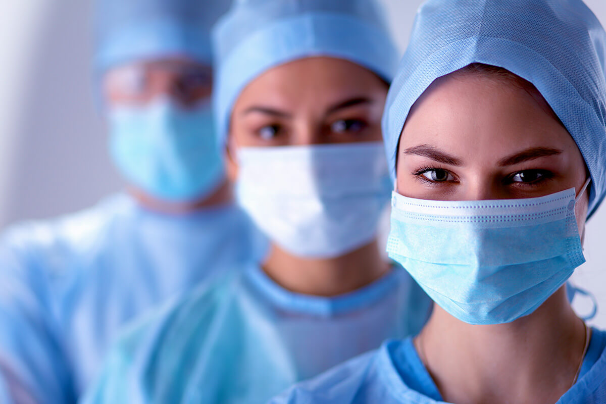 Surgeons wearing surgical masks