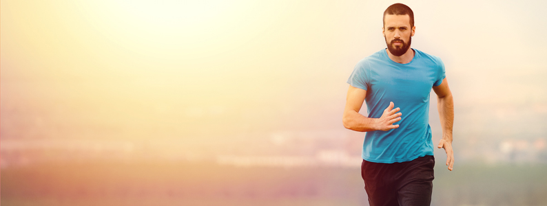 Young man running outside