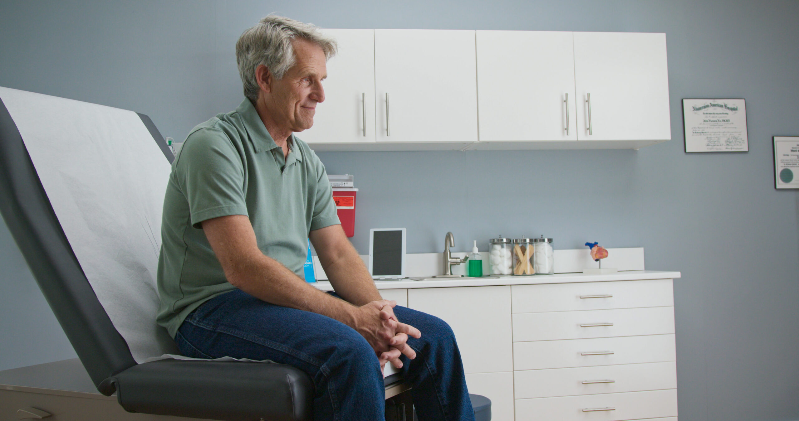 Man sitting on exam table