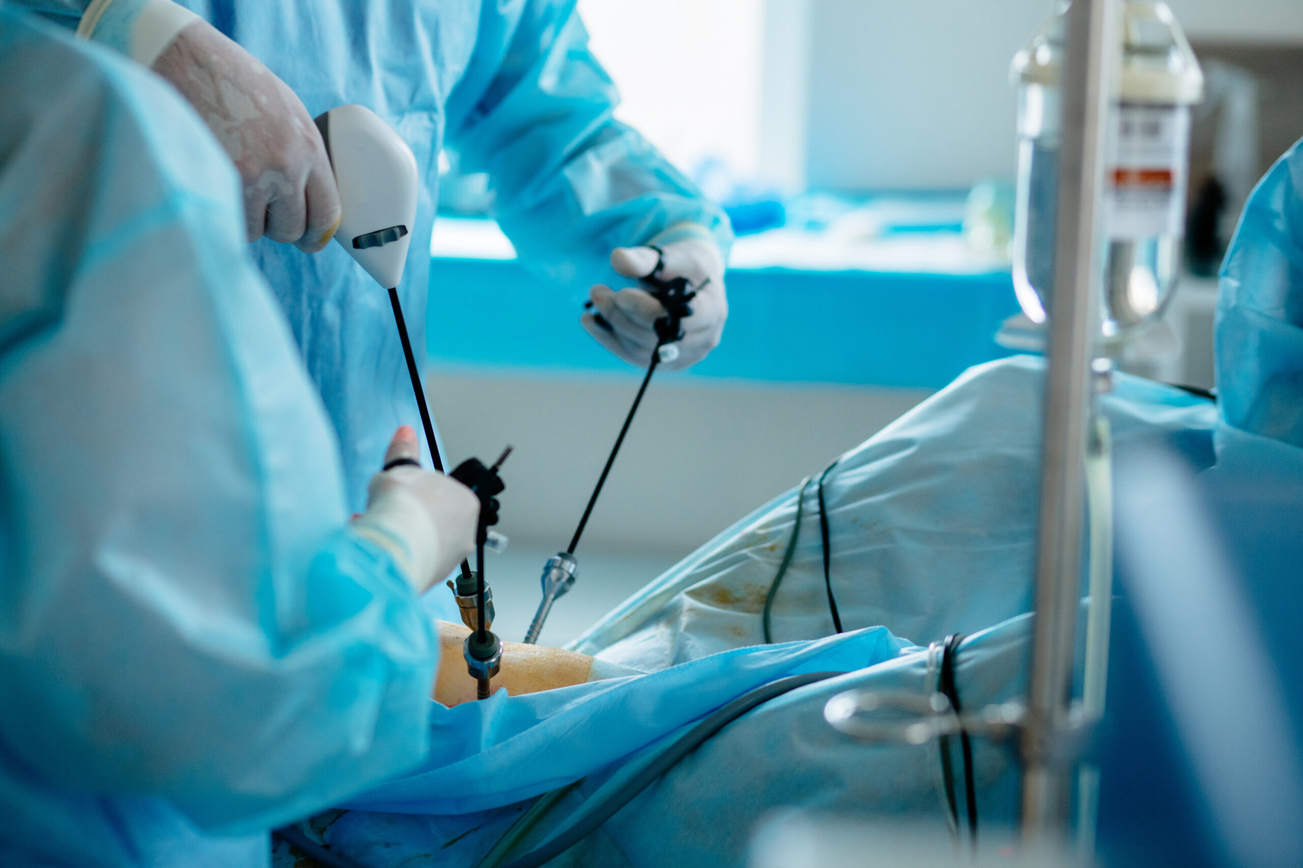Doctor performing surgery using advanced instruments